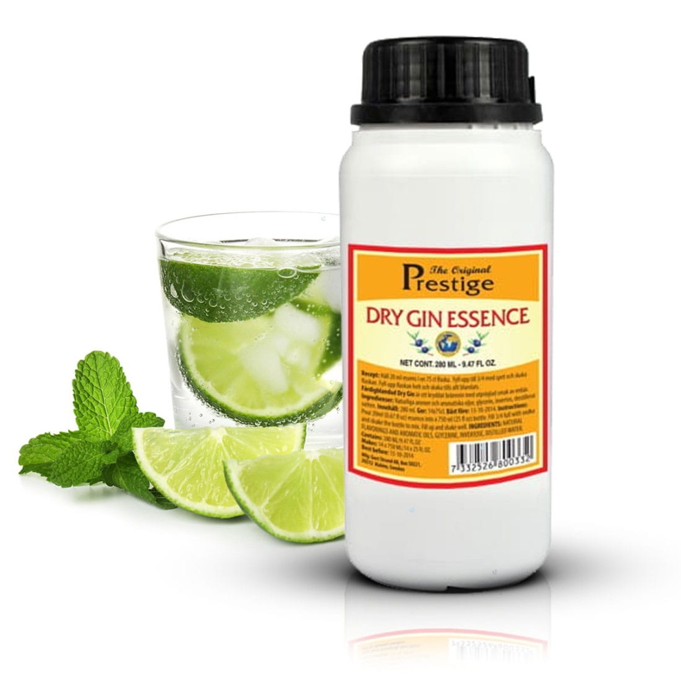 Biała butelka zaprawki do alkoholu Prestige Dry Gin Essence Flavour Concentrate o pojemności 280 ml.Obok zaprawki szklana z drinkiem z limonką i liściem mięty